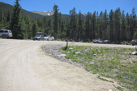 North Mount Elbert Trailhead - parking area and privy. Mount Elbert is in the background.