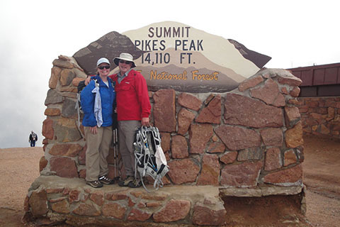 Friends at a  summit sign