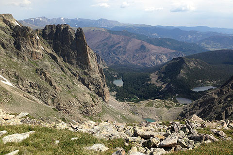 Looking down to mountains, lakes and forests from the trail near the Continental Divide