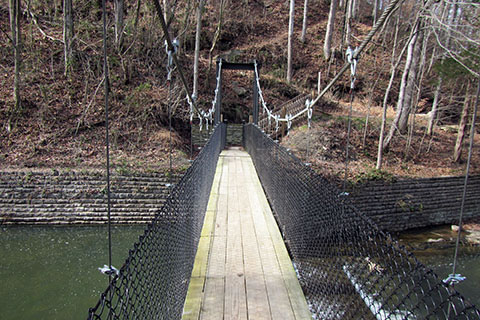 Bridge with trail rising above