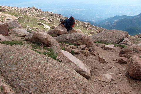 tired hikers with still a couple of miles to go to the summit